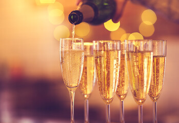 Champagne glasses on gold background. Party concept