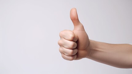 Thumb up gesture. Hand on isolated background.