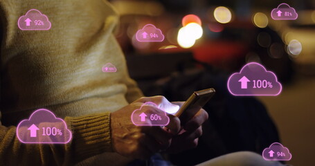 Image of digital clouds with percent going up over man using smartphone