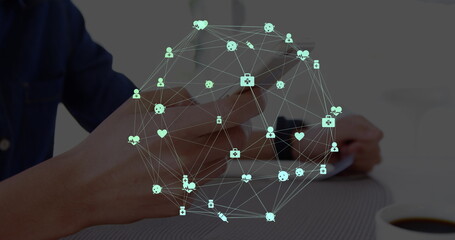 Image of network of connections with icons over men using smartphone
