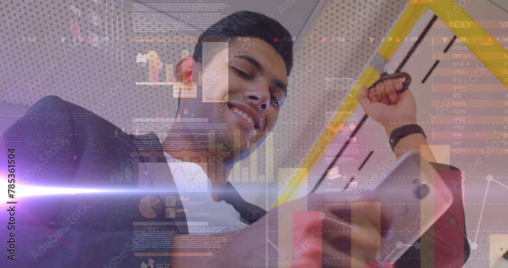 Poster image of graphs and data over biracial man using smartphone in bus