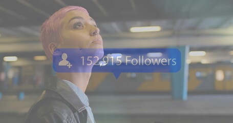 Image of thank interface with thank interface and data processing over smiling businesswoman using s