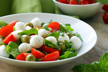 mozzarella cheese for salad with tomatoes and basil