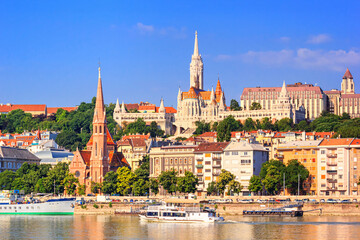 Fototapeta na wymiar City summer landscape - view of the Buda Castle, palace complex on Castle Hill with Matthias Church over the Danube river in Budapest, Hungary