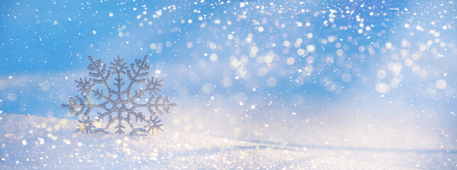Christmas winter background, banner - view of decorative snowflake in sparkling snow, copy space...