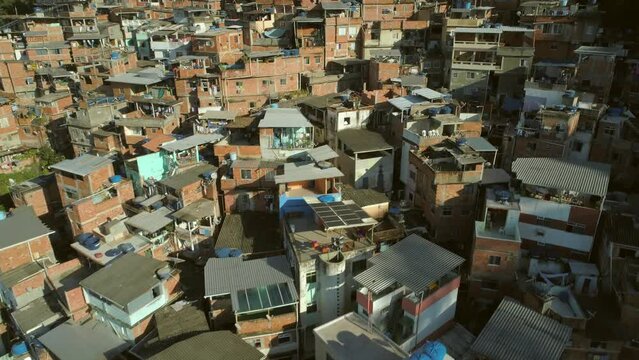 Aerial flying close over hillside favela houses in Rio de Janeiro, Brazil
