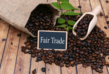 Coffee beans with the inscription Fair Trade on a sign.