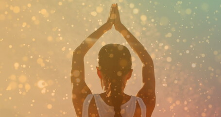 Image of spots over caucasian woman practicing yoga