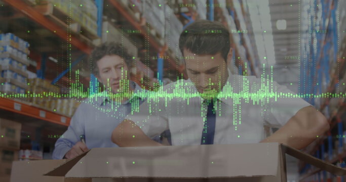 Image of financial graphs and data over caucasian male warehouse workers