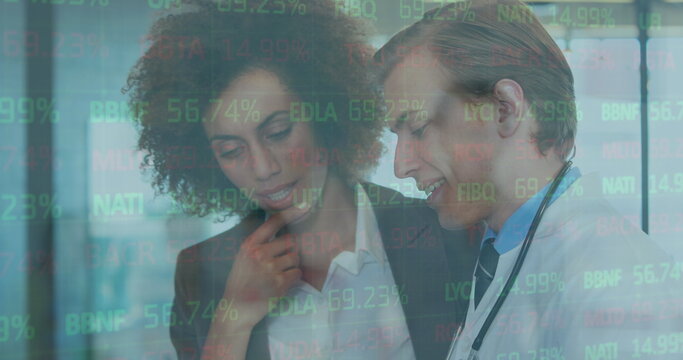 Image of financial data processing over diverse doctors - Powered by Adobe