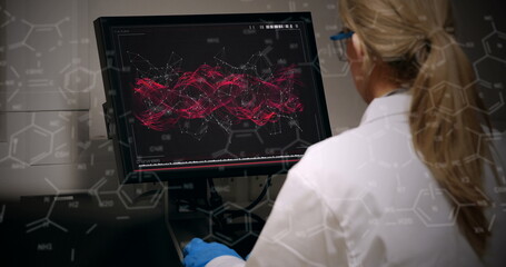 Image of chemical formulas over back view of caucasian female lab worker using computer - Powered by Adobe