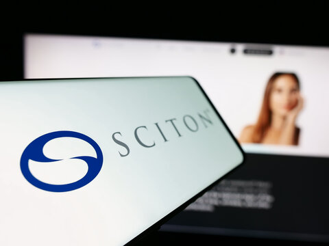 Stuttgart, Germany - 04-05-2024: Cellphone with logo of American medical device company Sciton Inc. in front of business website. Focus on left of phone display.