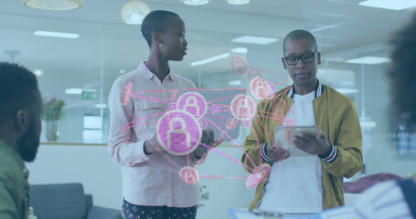 Image of diverse data over diverse male and female surgeons during operation