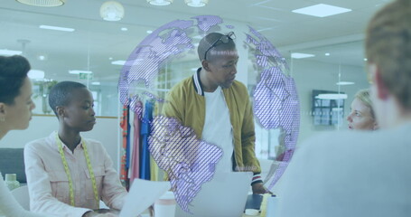 Image of globe and connections over diverse coworkers in office
