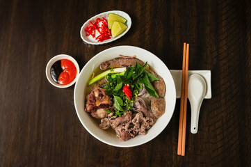 Phở. Vietnamese beef noodles soup with fresh basil