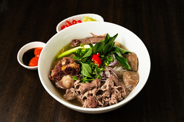 Phở. Vietnamese beef noodles soup with fresh basil