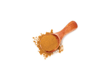 Cinnamon powder in a wooden spoon isolated on white background. Spicy spice for baking, desserts and drinks. Fragrant ground cinnamon.