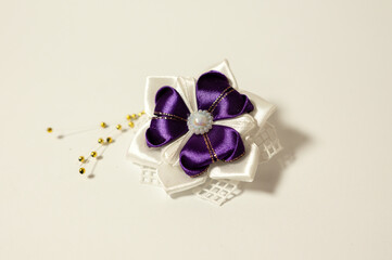 A handmade hair clip decorated with artificial flower