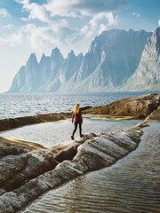 Woman tourist walking in Norway travel healthy lifestyle outdoor adventure summer vacations trip explore Senja island Tungeneset viewpoint - 785383317