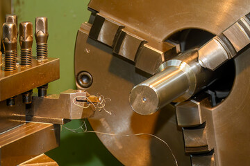 The turning machine operation with continue chip from turning process.