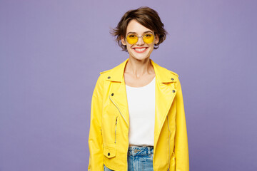 Young smiling cheerful fun happy woman she wearing yellow shirt white t-shirt casual clothes glasses looking camera isolated on plain pastel light purple background studio portrait. Lifestyle concept. - obrazy, fototapety, plakaty