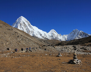 Trekking trail leading towards the Everest Base Camp and snow covered Mount Pumori, Nepal.