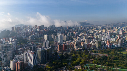 Fototapeta na wymiar Aerial drone view of Quito capital city of Ecuador South America Parque La Carolina Sunrise early morning traffic