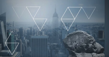 Image of networks of triangles with cityscape on blue background