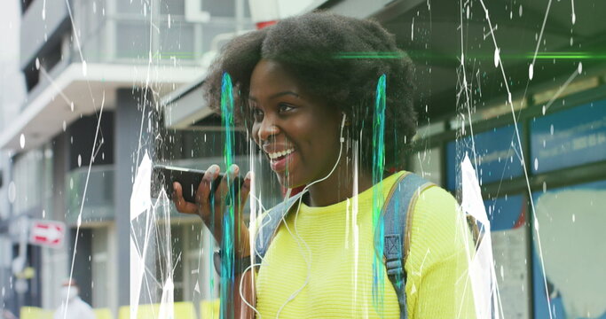 Image of abstract pattern over african american woman talking on phone wearing headphones - Powered by Adobe