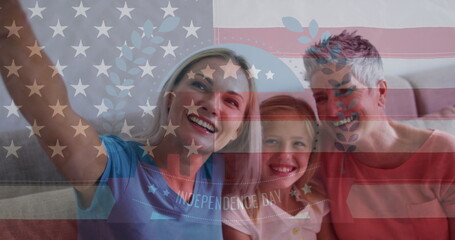 Image of waving usa flag over happy caucasian family