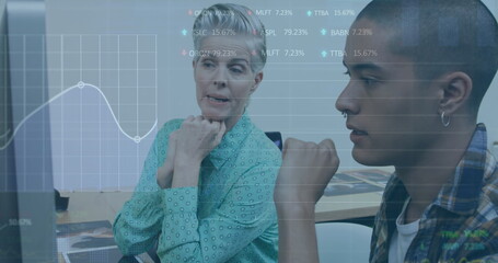 Image of trading board, graph over diverse coworkers discussing reports over computer in office