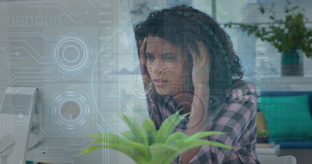 Image of data processing over biracial businesswoman using phone headphone in office