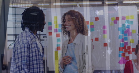 Image of financial data processing over diverse business people in office