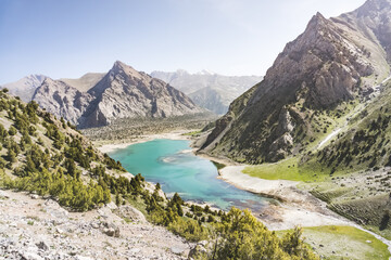 Blue lake Kulikalon in the valley basin from the height of the pass on a sunny summer day in the...