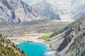 Blue lake Kulikalon in the valley basin from the height of the pass on a sunny summer day in the...