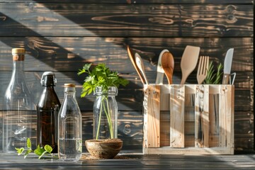 Kitchen utensils and glass bottles on a rustic wooden table against a wooden wall