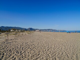 Obraz premium Landscape of the beach with mountains, Mediterranian cost of Spain, El Grao de Castellon, Valencia, Spain