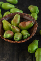 Parisian pear variety. Fruits on the table. Autumn harvest. Pears top view background. Green yellow red color pear. Vitamin vegan food.
