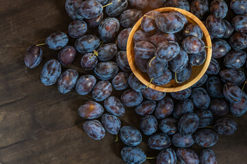 Plum variety Hungarian. Fruit harvest on the table in the kitchen. Autumn blue plum. Vitamin food bowl.