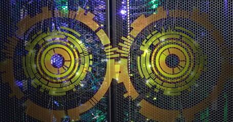 Image of two round scanners spinning against computer server room
