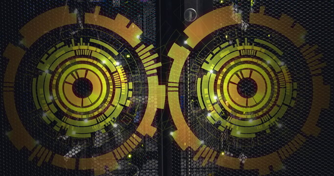 Image of two round scanners spinning against computer server room