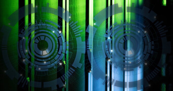 Image of two round scanners spinning against computer server room