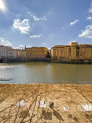 Papier Peint photo Ponte Vecchio View from the Ponte Vecchio over the Arno river, in the ancient medieval city of Florence, Italy.