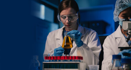 Scientist works with a pipette and a test tube. Scientific laboratory of biotechnology, development...