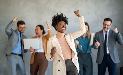 Excited overjoyed diverse business people, team celebrate corporate victory together in office - 785417560