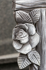 Decorative element in the shape of a rose on the fence in an old castle.