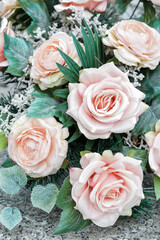 Obraz na płótnie Canvas Adorable wedding decoration made of pink artificial roses.