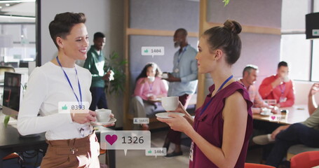 Image of notification bars over diverse female coworkers sharing ideas while drinking tea