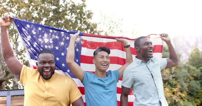 Naklejki Image of go vote text and american flag with happy diverse friends celebrating and waving flags