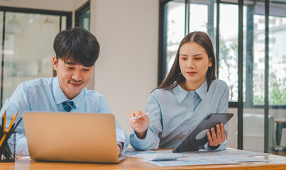 group of business people working and communicating together in the office With the charging of graphs for analysis, conceptual analysis and business planning